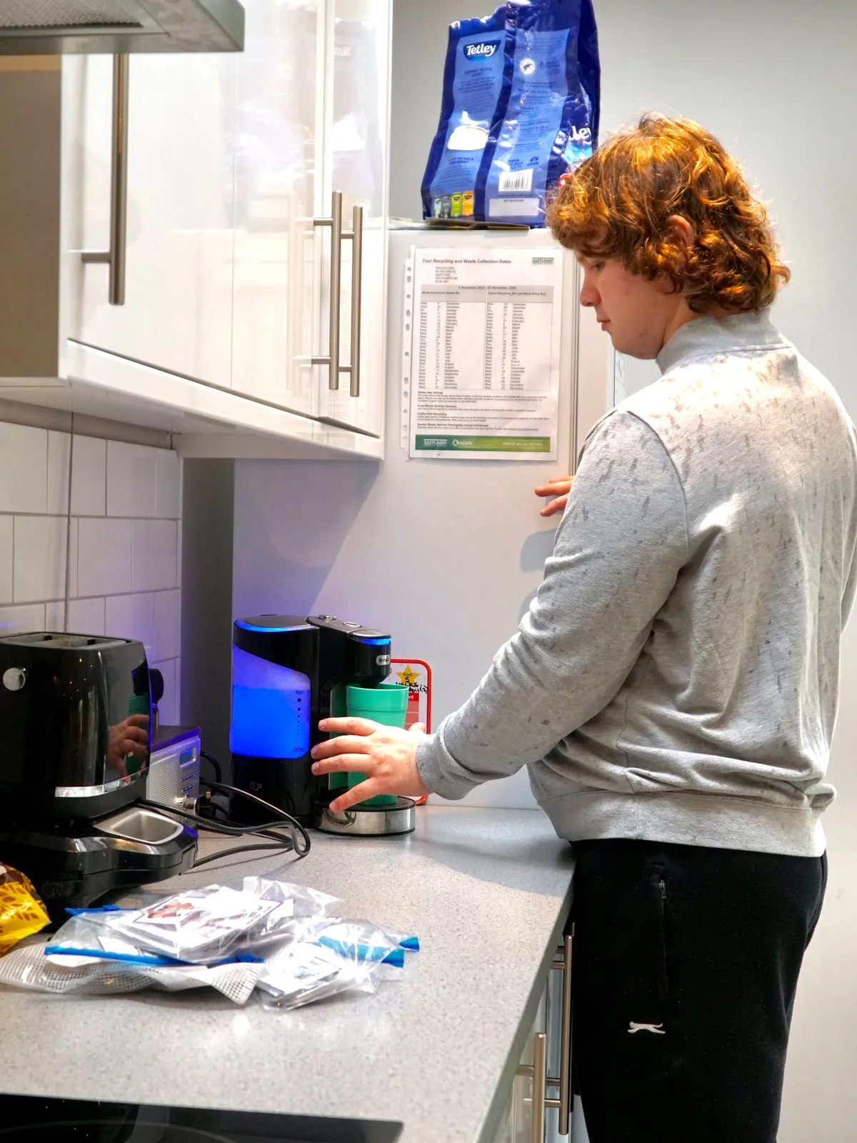 Making myself a drink in my kitchen